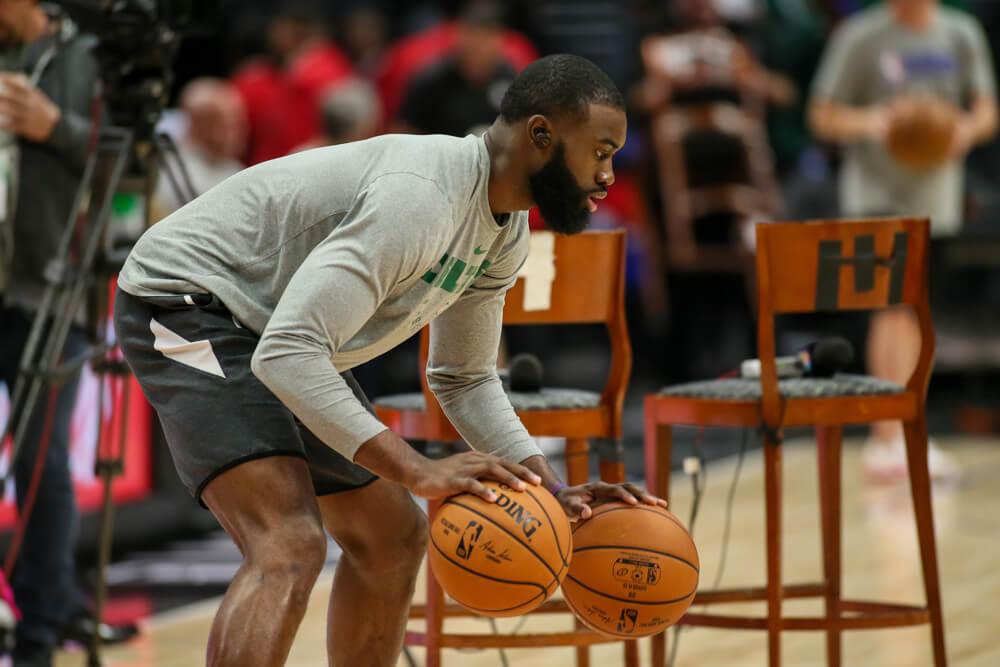 Jaylen Brown dribbling two basketballs pregame