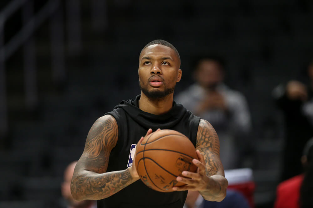 Damian Lillard preparing to shoot ball in warmup