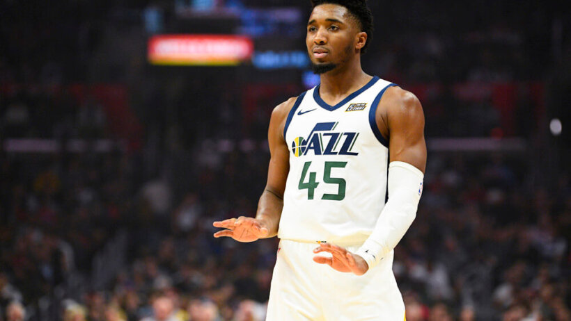 Donovan Mitchell palms out to the ground