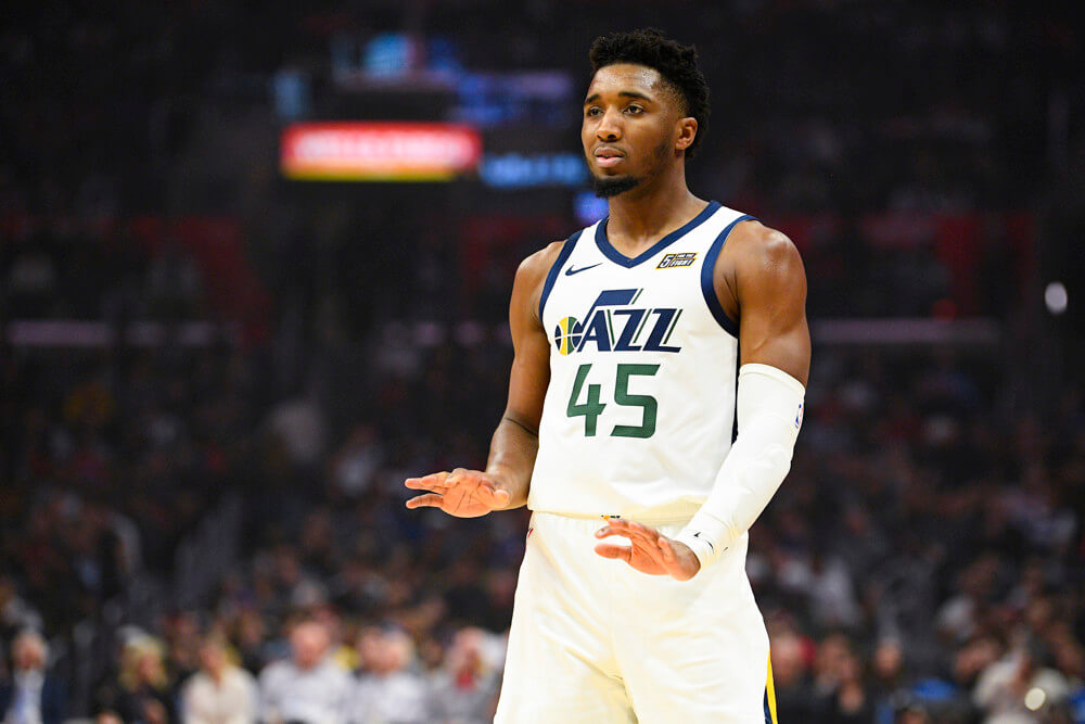 Donovan Mitchell palms out to the ground