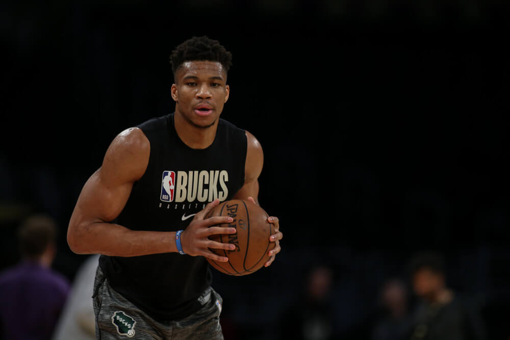 Giannis Antetokounmpo warms up