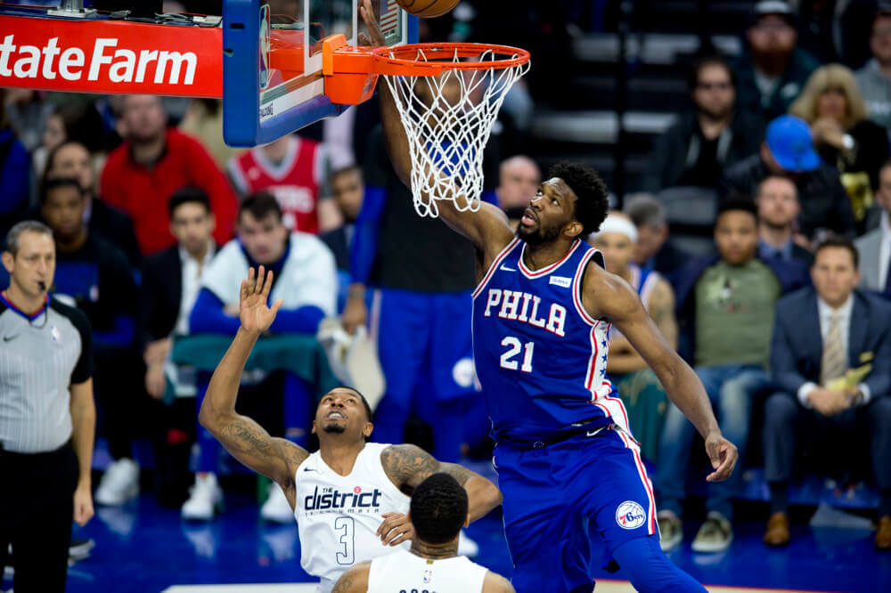 Joel Embiid drives against Washington