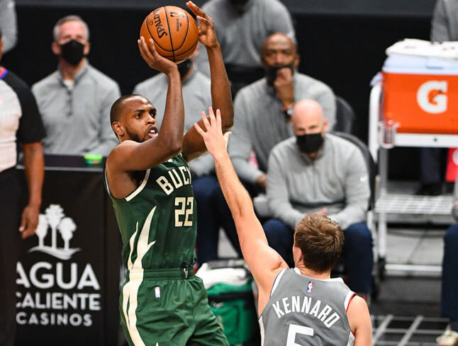 Khris Middleton shooting over defender