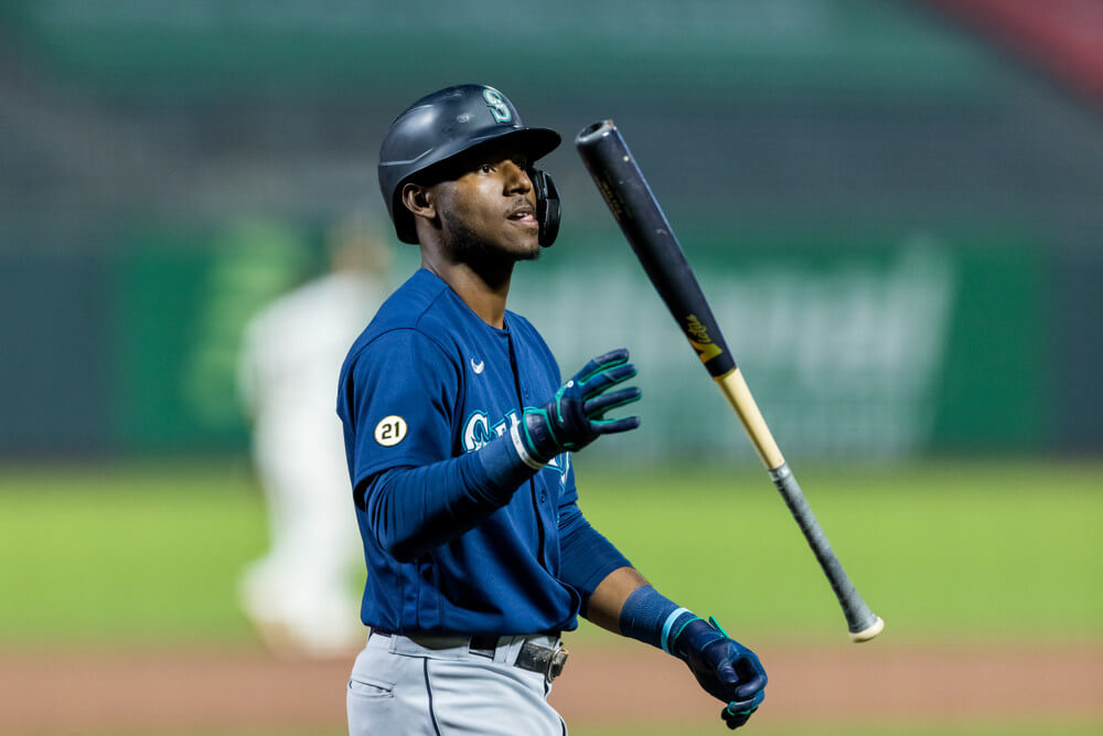 Seattle Mariners right fielder Kyle Lewis walking back to the dugout