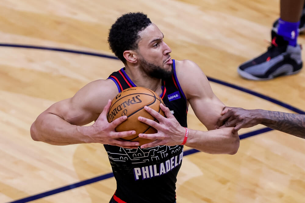 Ben Simmons cradling ball on drive