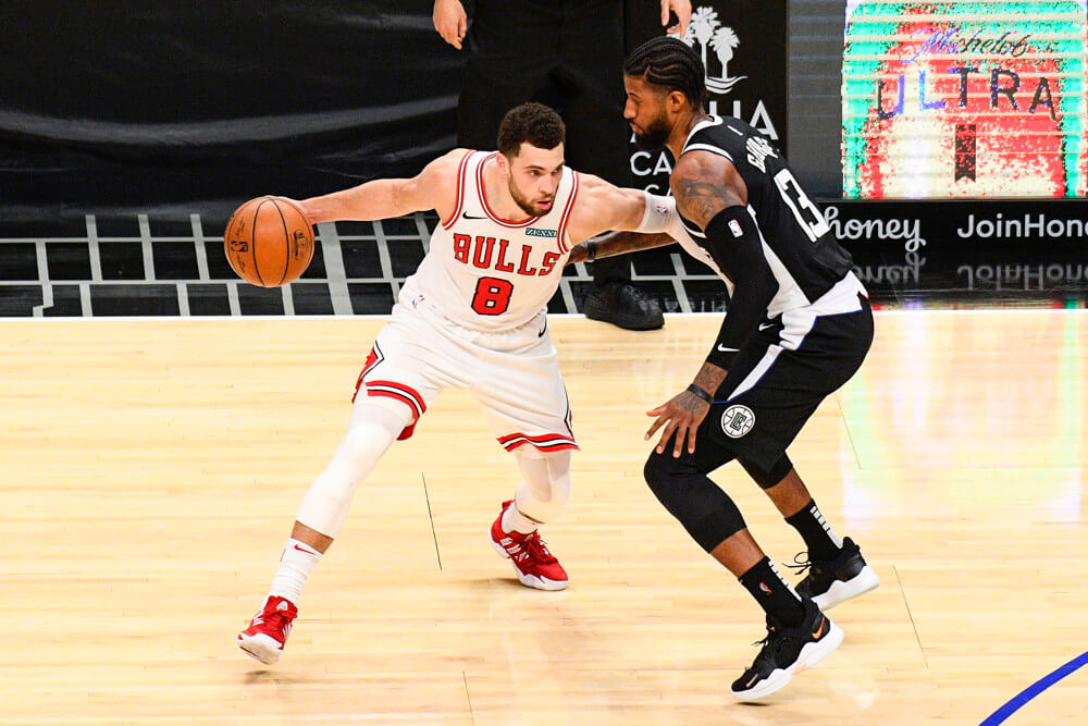Zach LaVine dribbling covered by defender