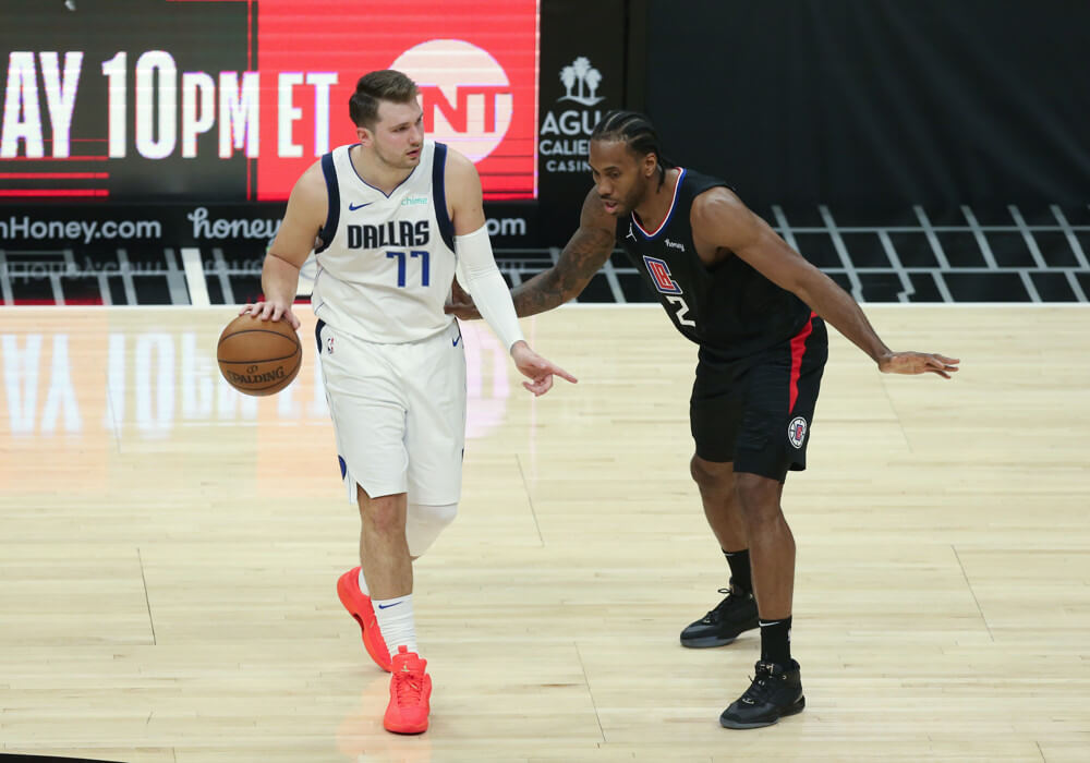 Luka Doncic guarded by Kawhi Leonard