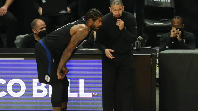 Paul George hands on knees talking to Tyronn Lue