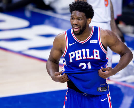 Joel Embiid untucking jersey