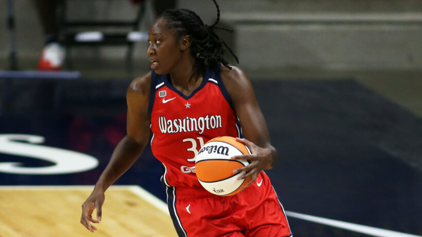 Tina Charles of the Washington Mystics dribbling the ball during a WNBA game.