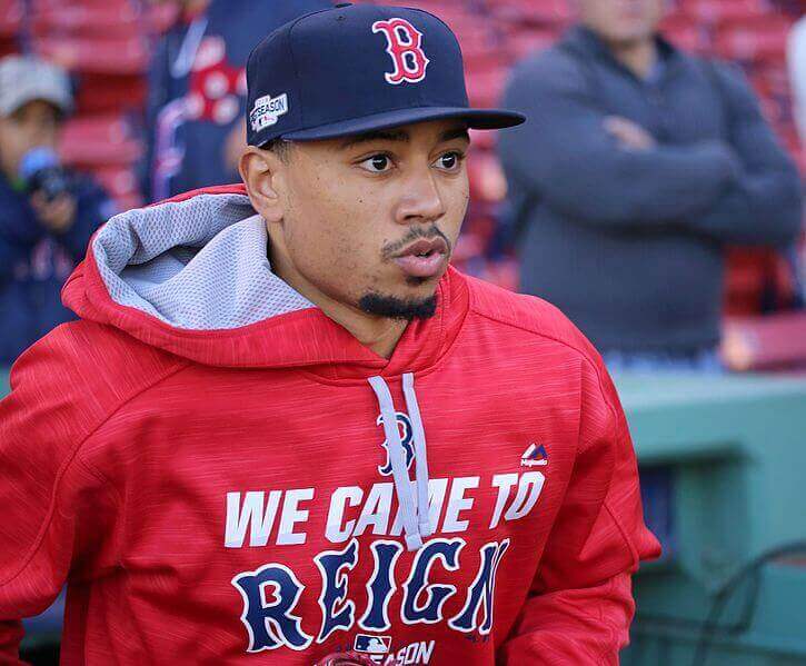 Mookie Betts jogging on the field at Fenway Park