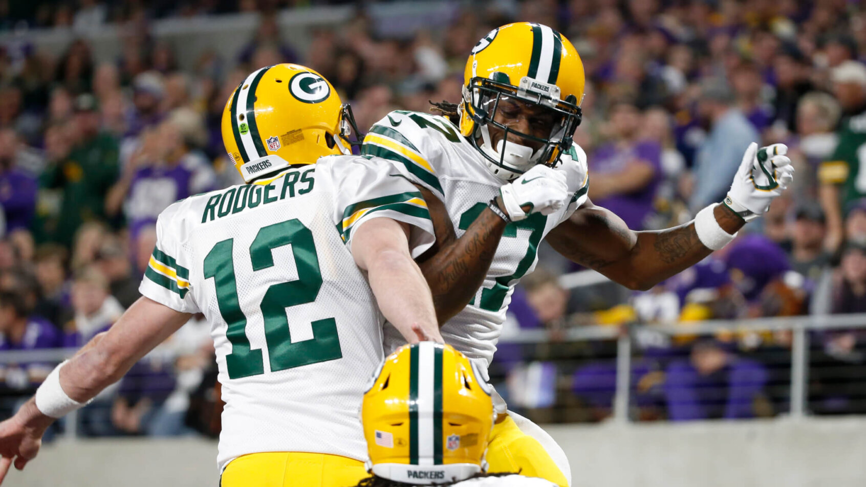 Aaron Rodgers and Davante Adams leaping celebration