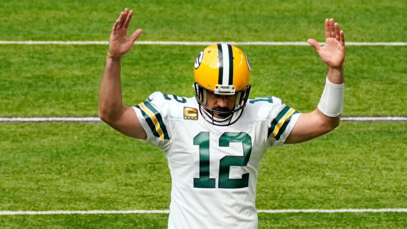 Aaron Rodgers arms up in TD signal