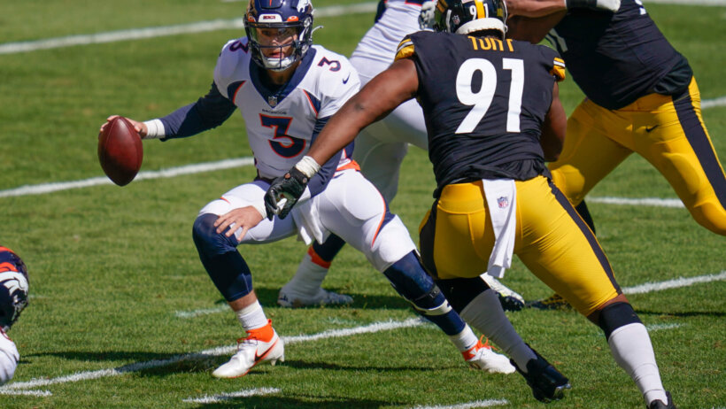 Drew Lock pressured by Pittsburgh defense