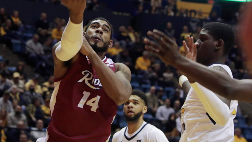 Rider guard Dimencio Vaughn driving to the hoop