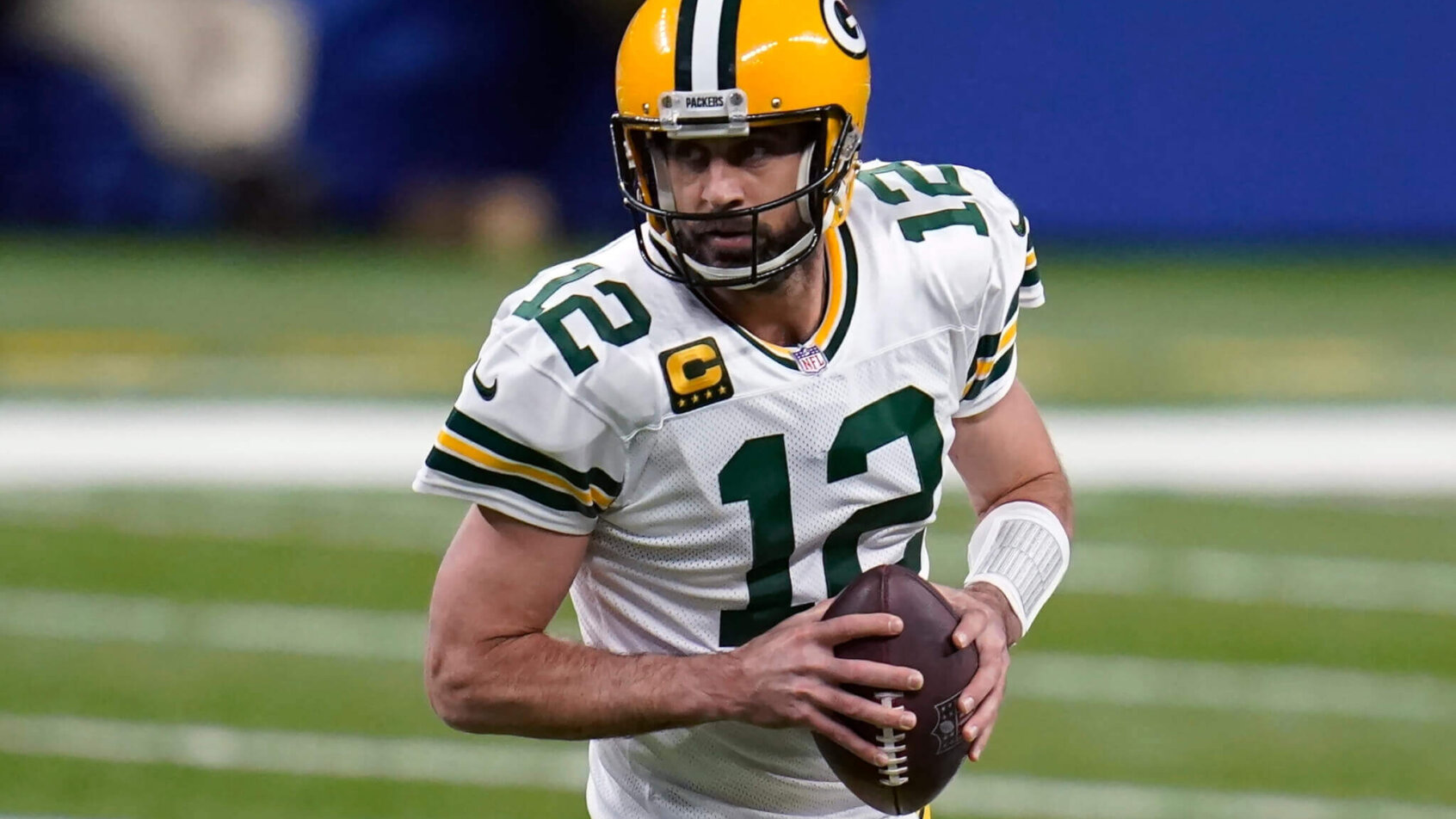 Aaron Rodgers rolls out looking to throw