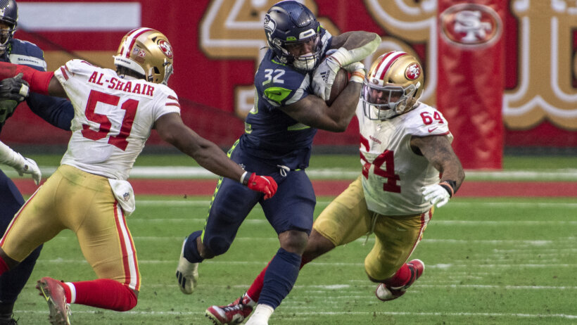 Seattle Seahawks running back Chris Carson carrying the ball against the San Francisco 49ers.