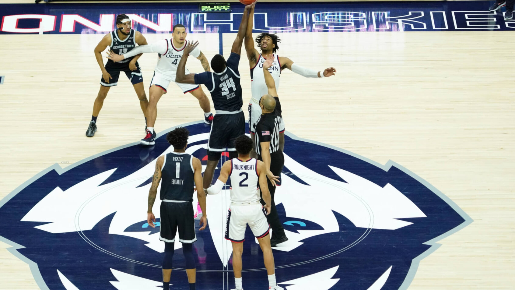 The Connecticut Huskies tip-off against the Georgetown Hoyas