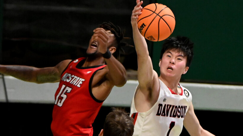 Davidson forward Hyunjung Lee grabbing a rebound