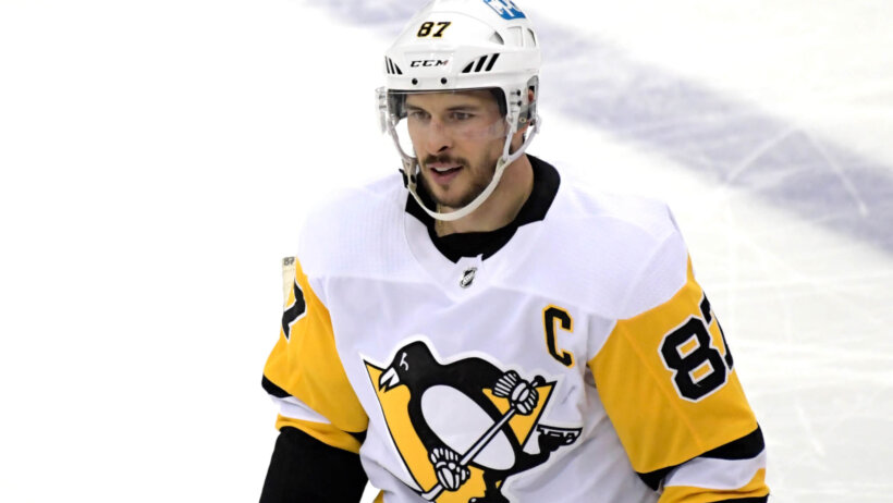 A mid shot of Sidney Crosby on the ice during a hockey game.