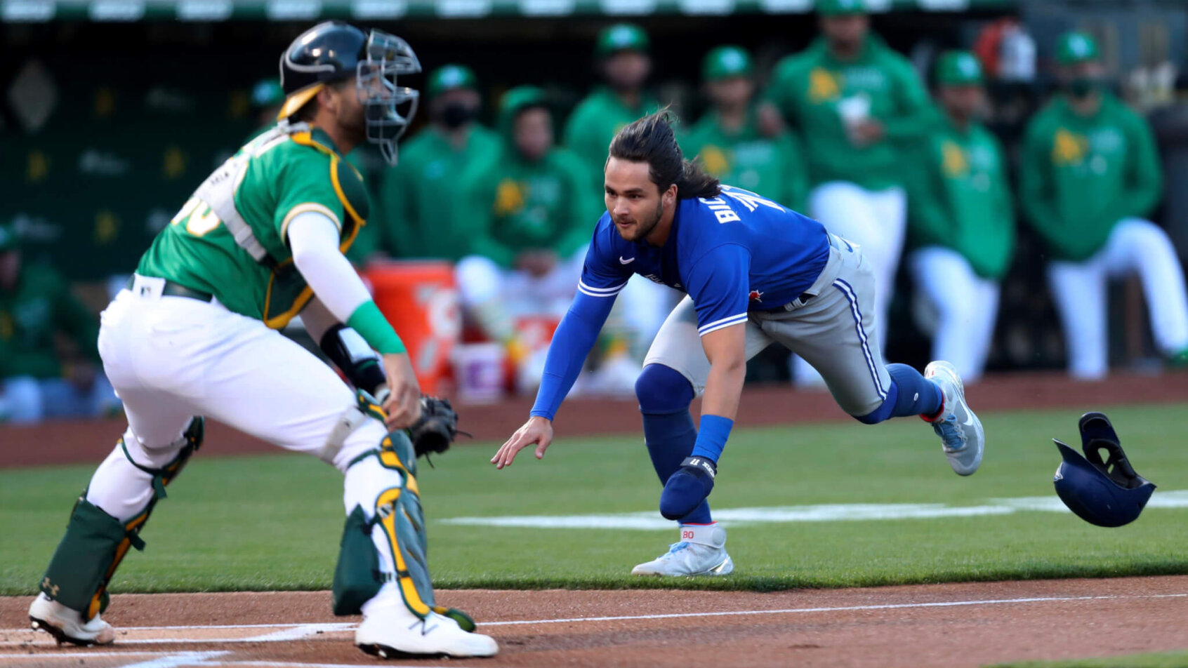 Toronto Blue Jays' Bo Bichette diving into home plate
