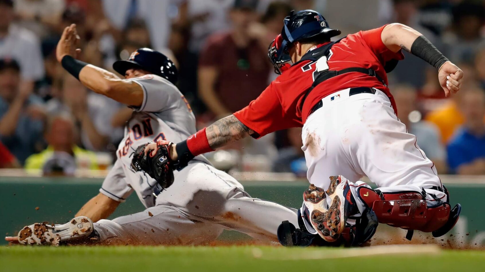 Boston Red Sox's Christian Vazquez tries to tag Houston Astros' Michael Brantley