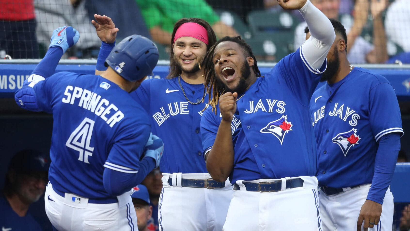 Toronto Blue Jays' George Springer, Vlad Guerrero Jr, Bo Bichette celebrate a home run