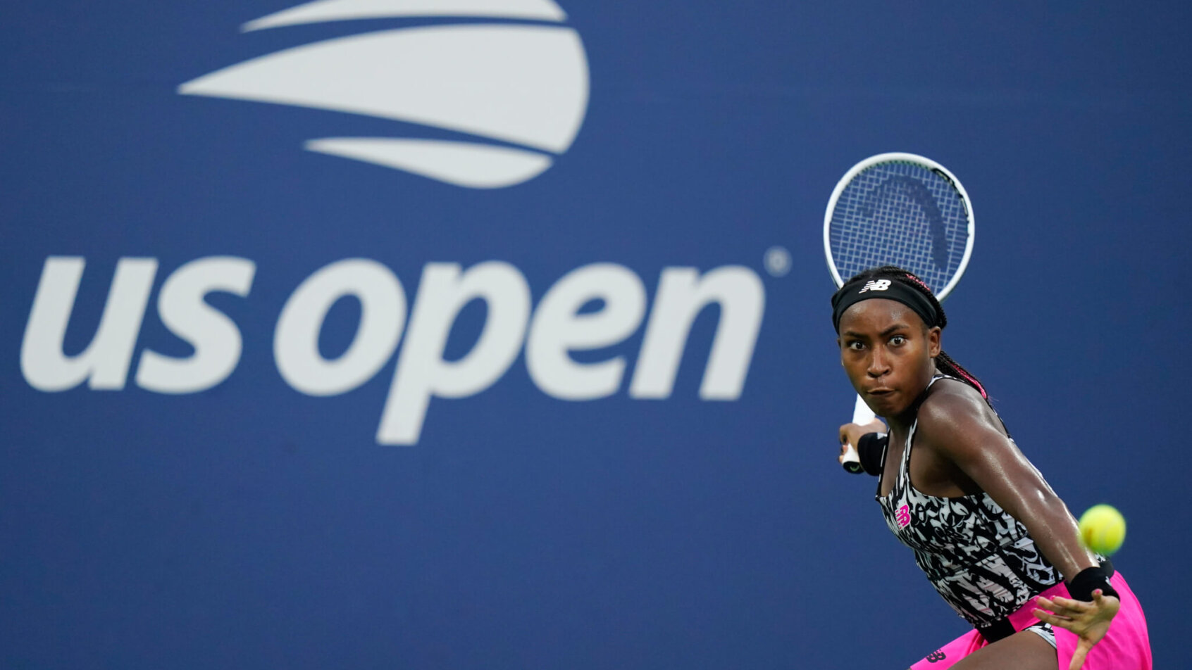 Cori Gauff returning a shot during a match at the US Open.