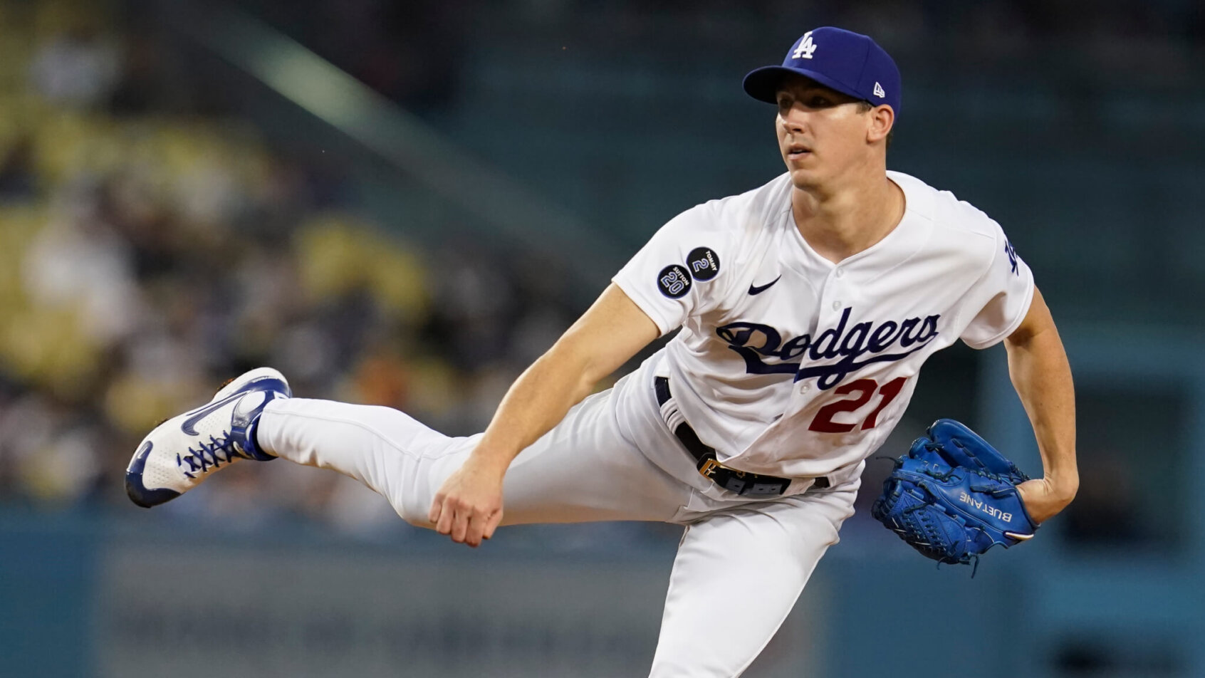 Los Angeles Dodgers pitcher Walker Buehler following through on a pitch during a game.