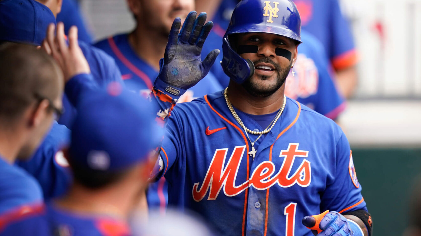 New York Met Jonathan Villar high-fiving teammates in the dugout
