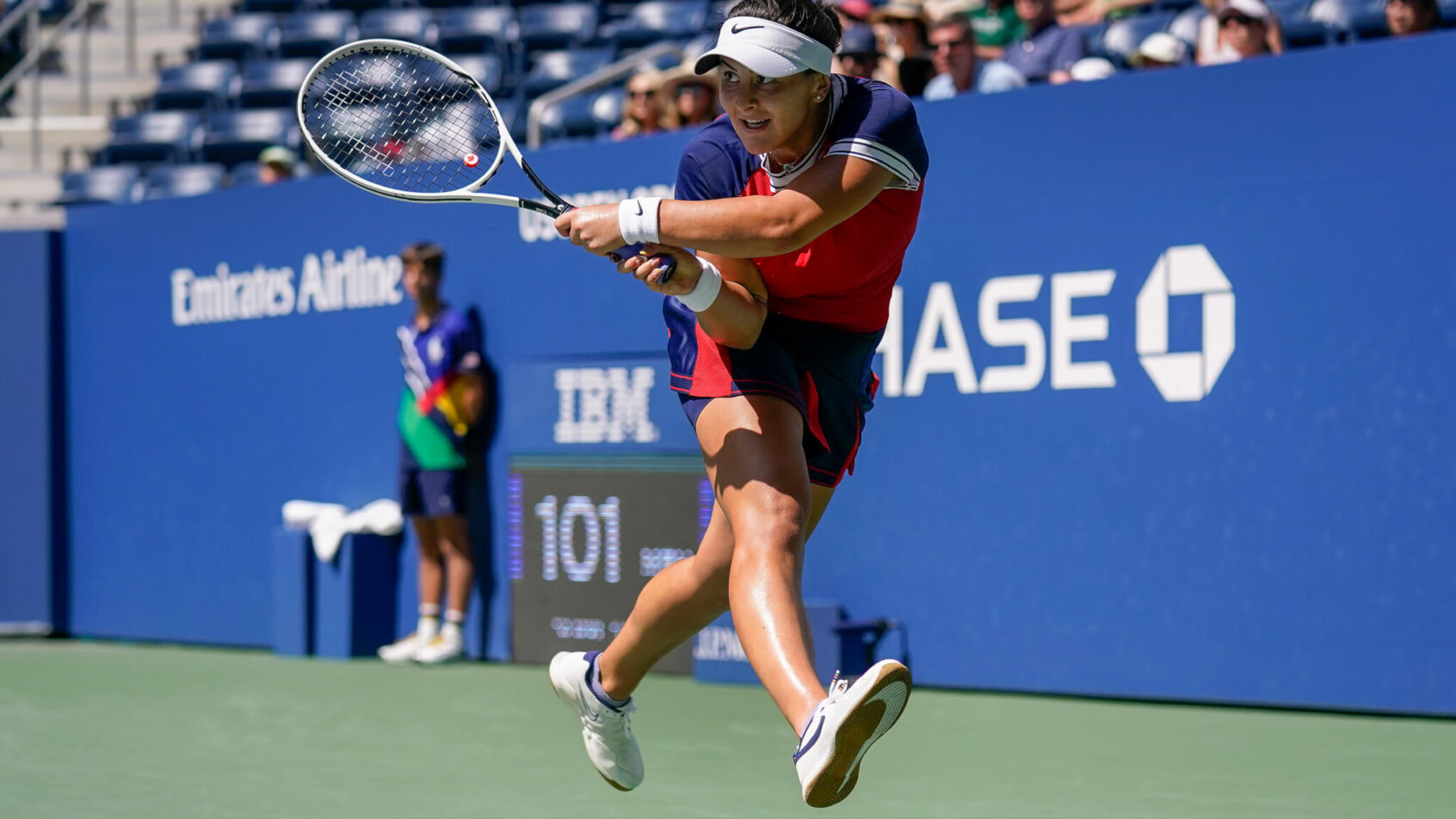Bianca Andreescu returning a shot to her opponent during a tennis match.