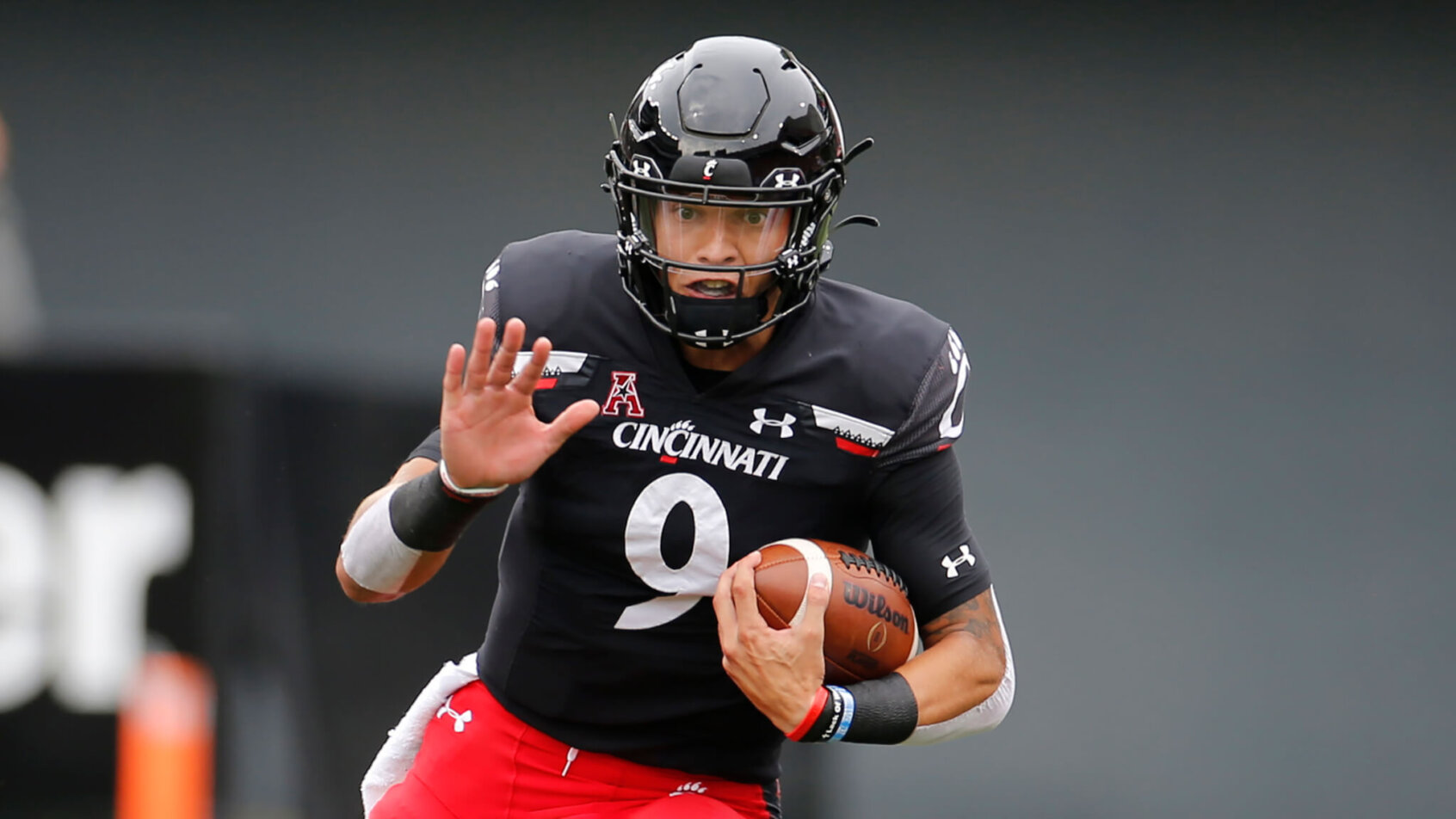 Desmond Ridder running with football