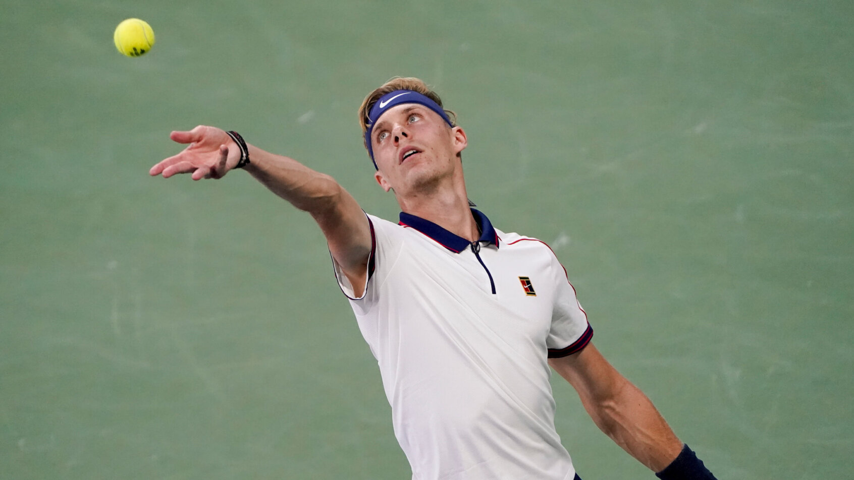 Denis Shapovalov tossing ball to serve