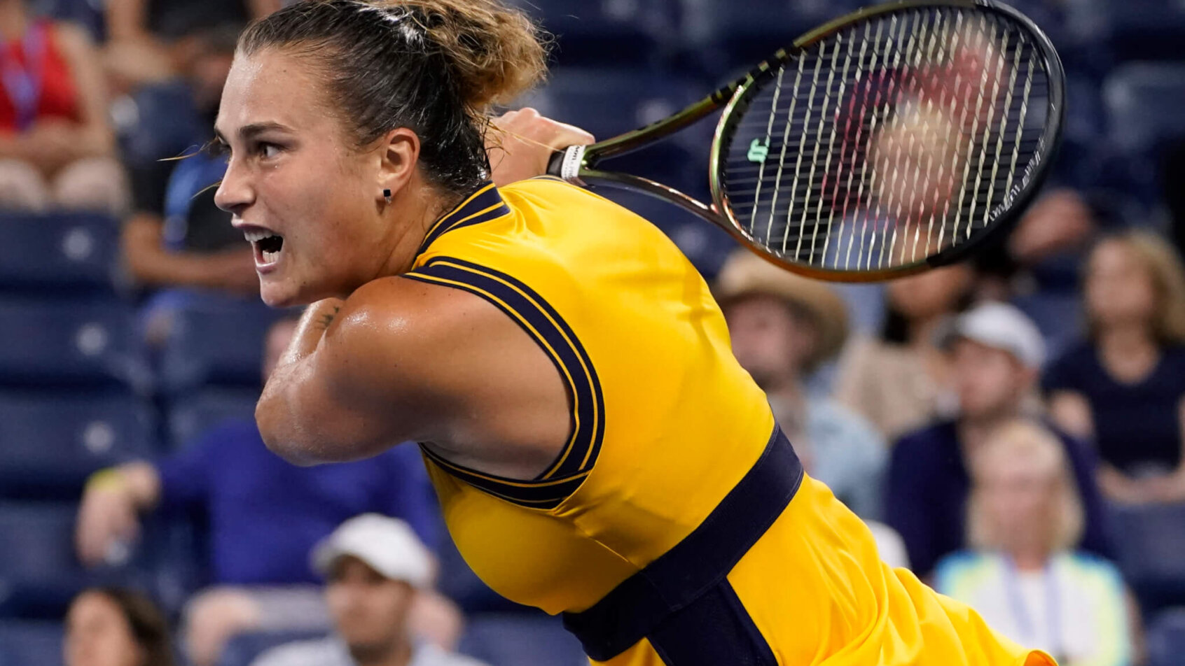 Aryna Sabalenka hitting a return during a tennis match at the US Open.