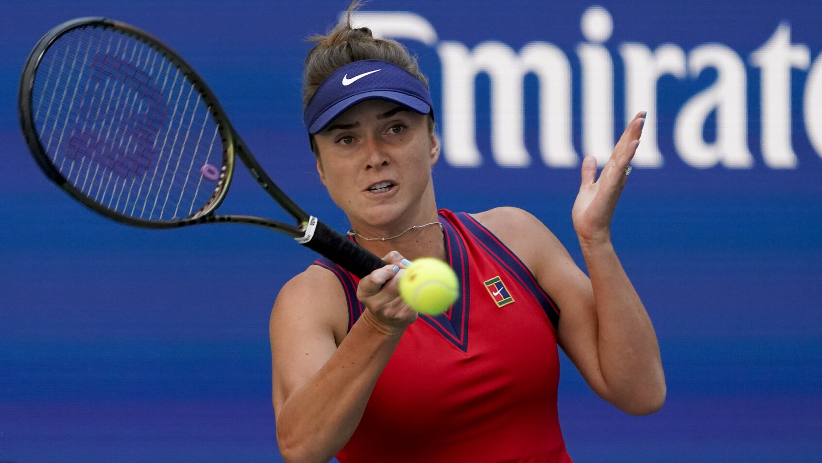 Elina Svitolina swinging at ball