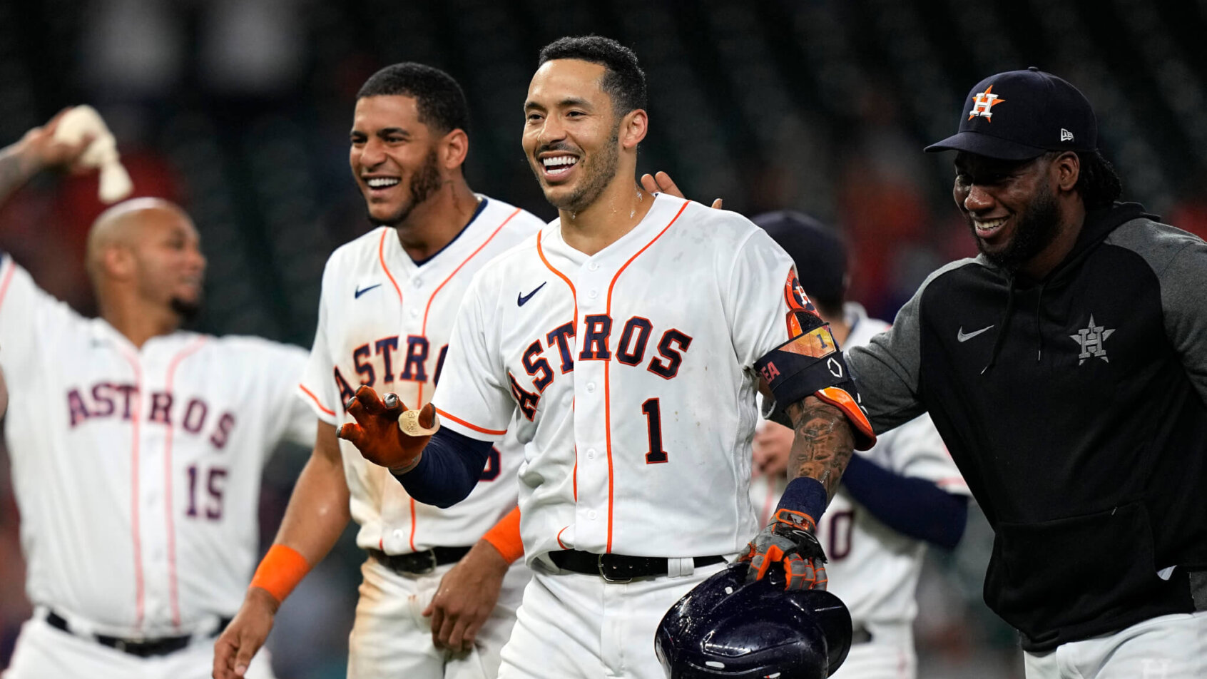 Houston Astros' Carlos Correa celebrating a game-winning hit in extra innings