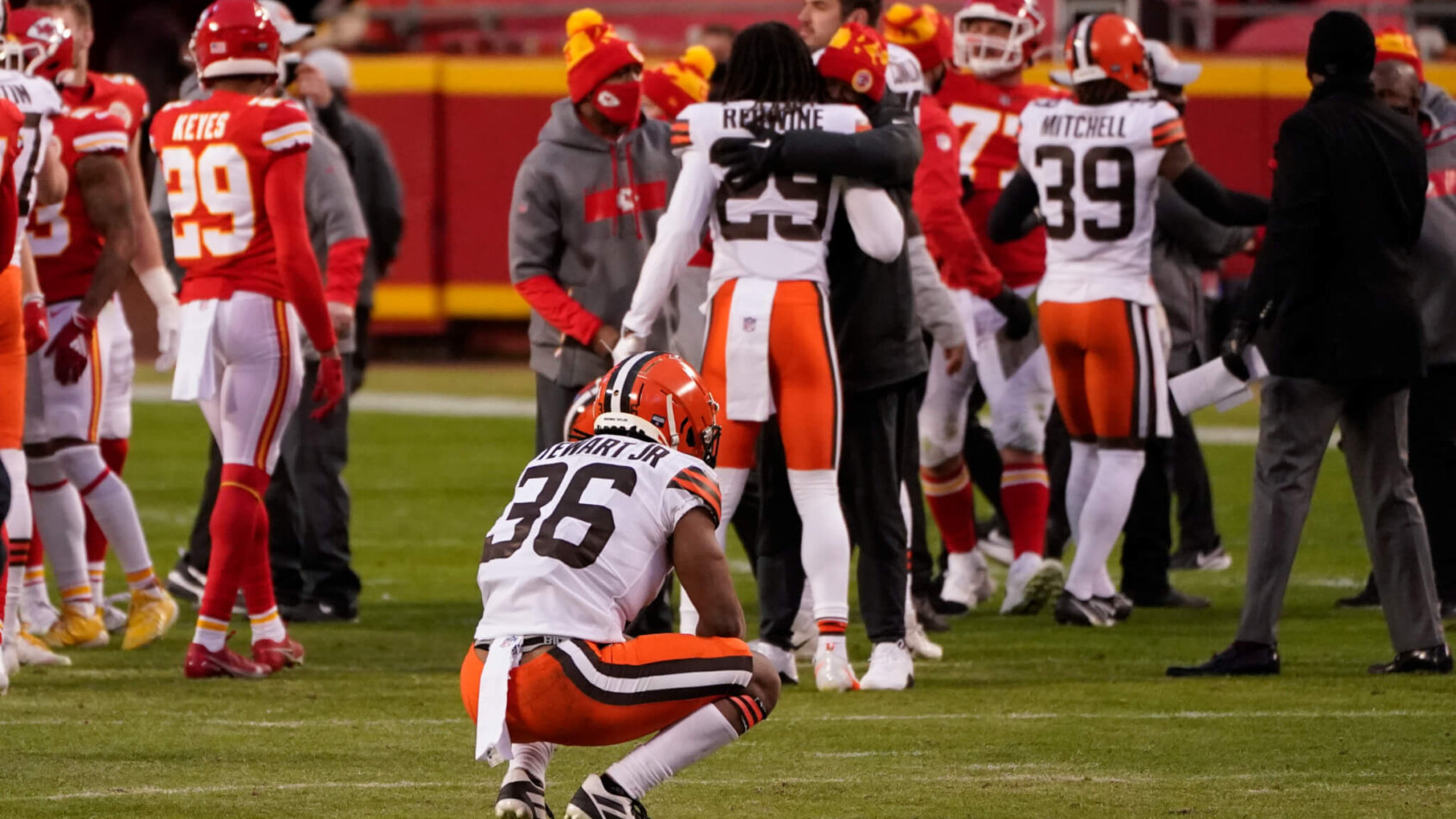 Cleveland player squatting on field after loss