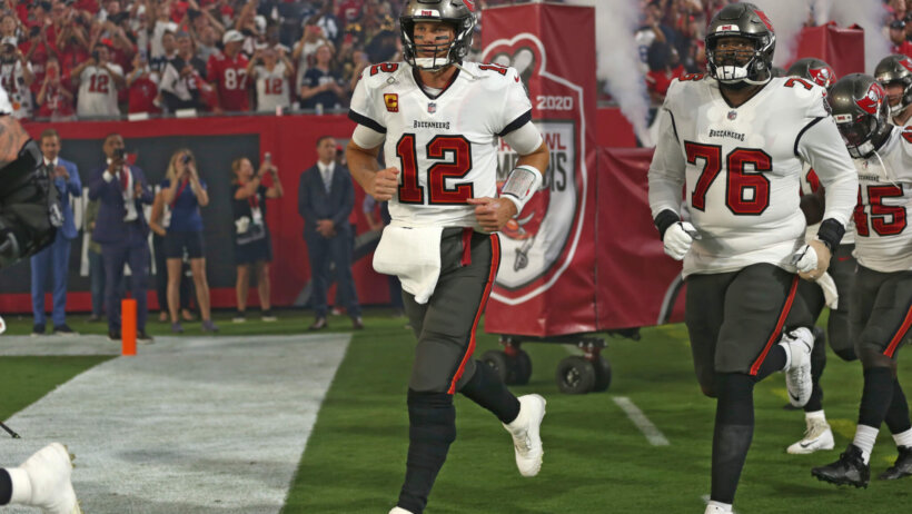 Tampa Bay Buccaneers running onto field