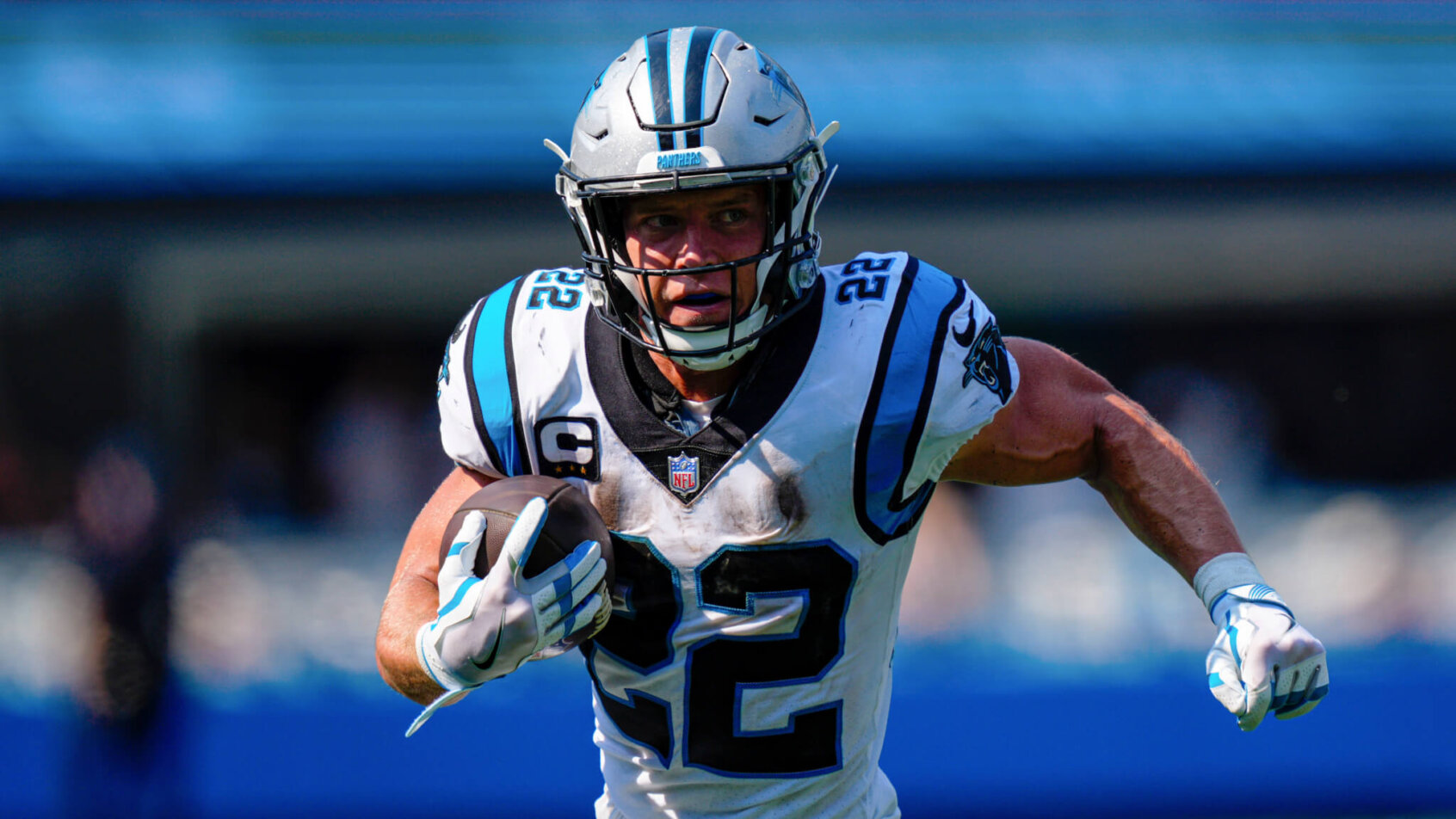Christian McCaffrey carries the ball
