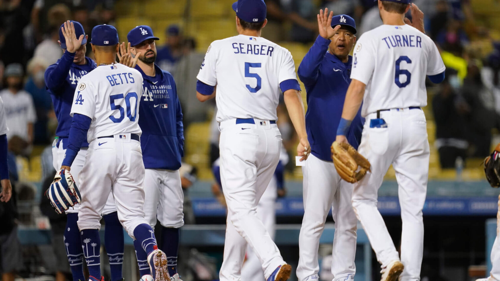 Dodgers players high fiving each other