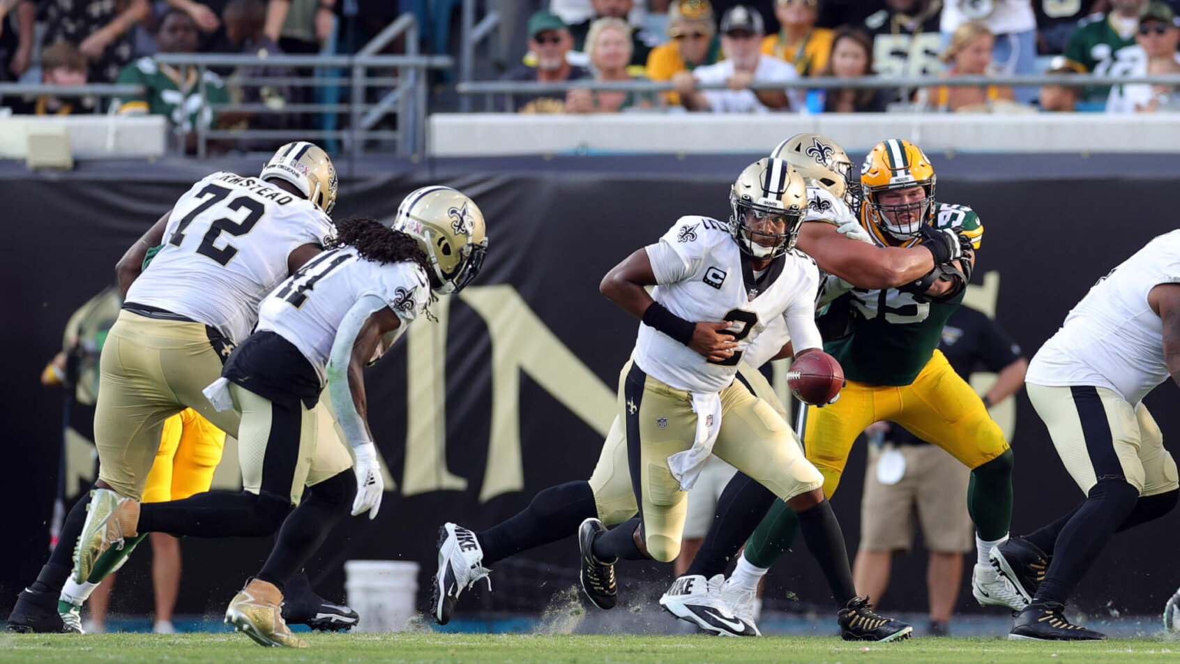 New Orleans Saints quarterback Jameis Winston getting ready to hand the ball off to Alvin Kamara