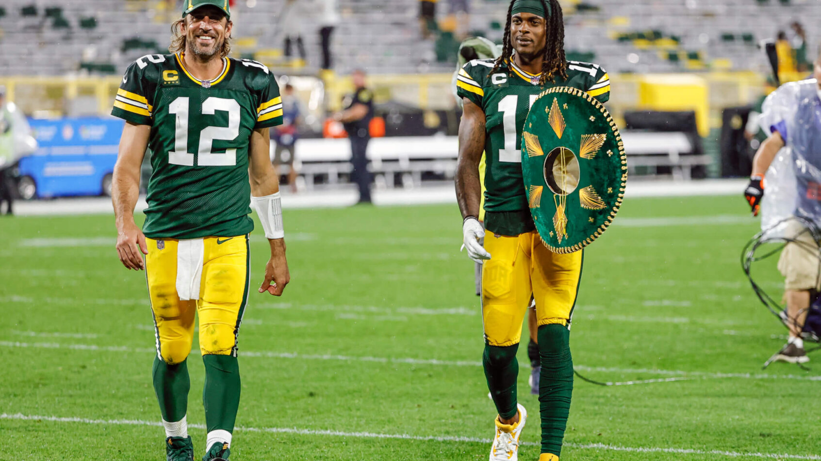 Aaron Rodgers and Adams walk off