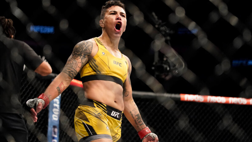 Jessica Andrade celebrating a win in the UFC octagon