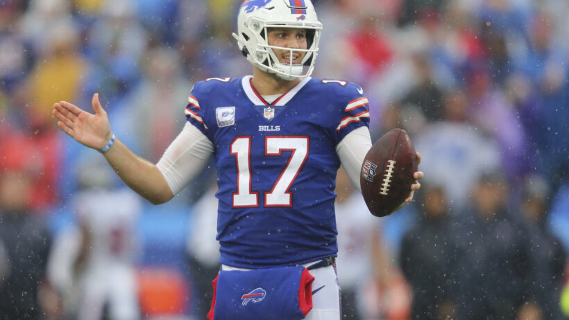 Josh Allen holding football with left hand