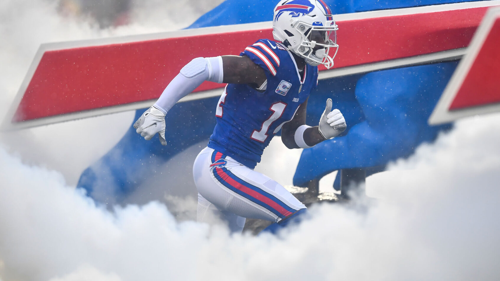 Stefon Diggs runs through the smoke machine