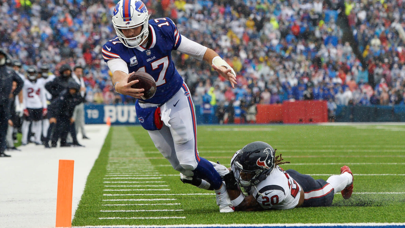 Josh Allen reaching for endzone while being tackled