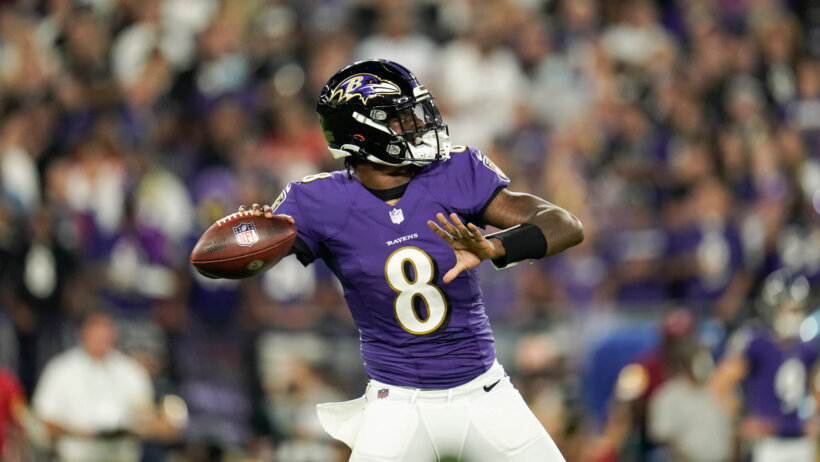 Baltimore Ravens quarterback Lamar Jackson throwing a pass during an NFL football game.