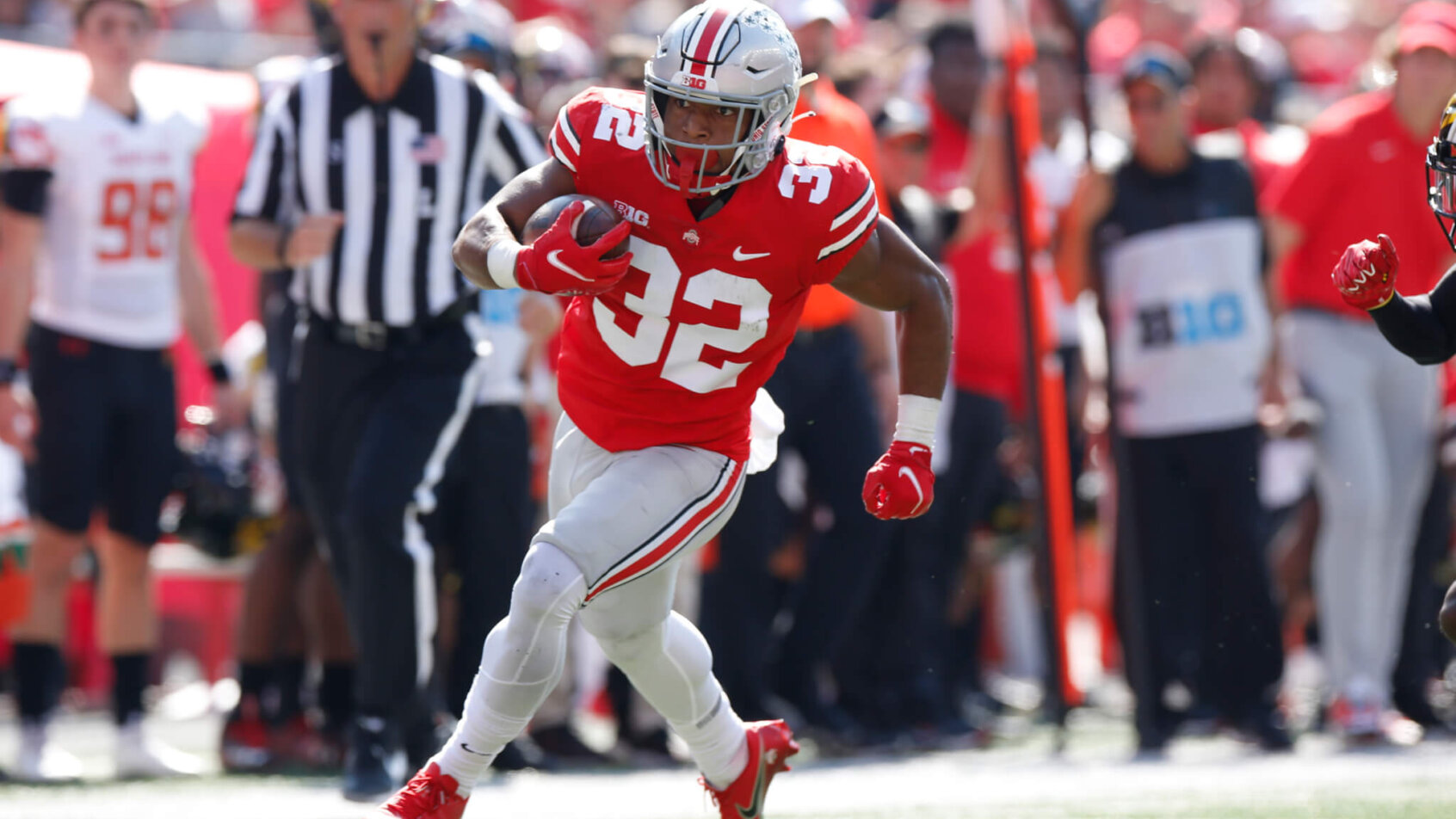 TreVeyon Henderson running with football