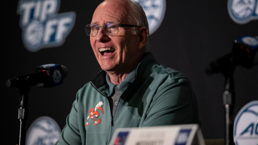 University of Miami head coach Jim Larranage smiling during a press conference.