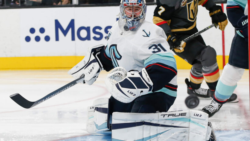 Philipp Grubauer watches puck in corner